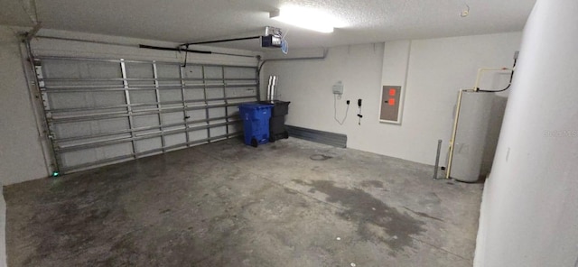 garage with gas water heater, electric panel, and a garage door opener