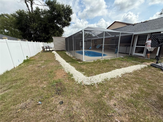 view of yard with a lanai and a patio area