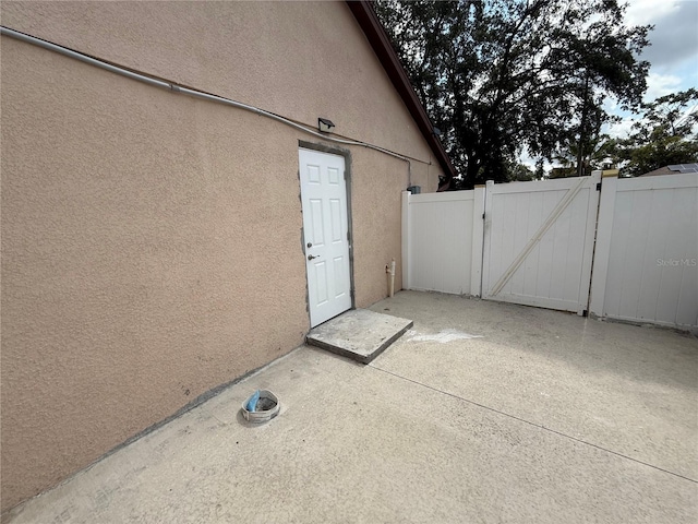 view of patio / terrace with a gate and fence
