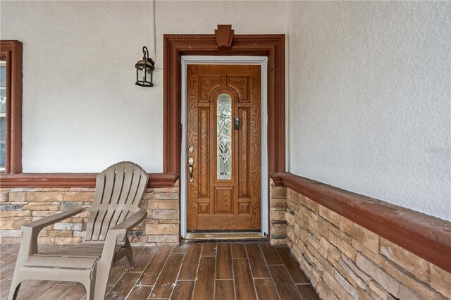 3104 Apricot St, Seffner, FL 33584 - view of exterior entry with stucco siding, stone siding, and a porch