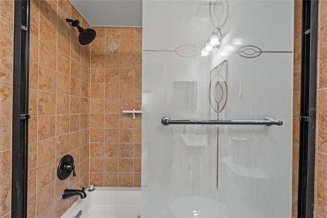3104 Apricot St, Seffner, FL 33584 - bathroom featuring shower / bath combination with glass door