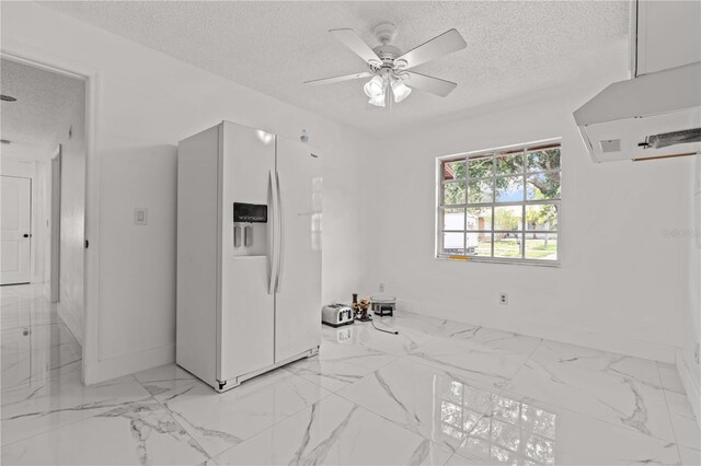 3104 Apricot St, Seffner, FL 33584 - spare room with a textured ceiling, baseboards, light marble finish floors, and ceiling fan