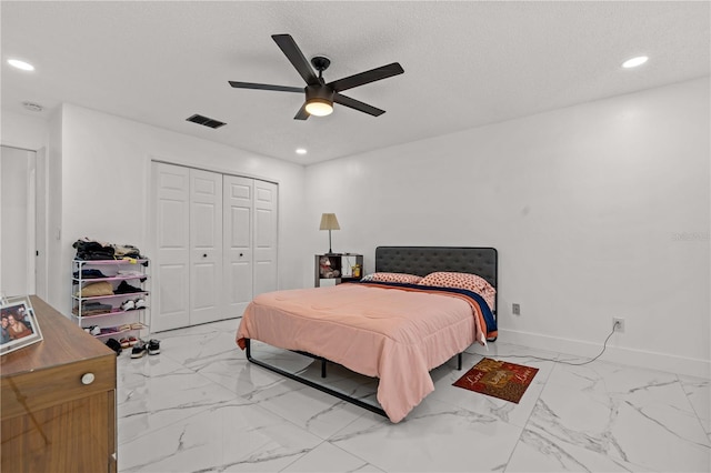 3104 Apricot St, Seffner, FL 33584 - bedroom featuring marble look tiles, a closet, recessed lighting, baseboards, and a ceiling fan