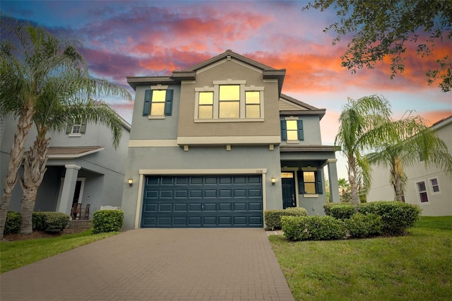 1028 Oliveto Verdi Ct, Brandon, FL 33511 - view of front of property featuring decorative driveway, an attached garage, stucco siding, and a front yard