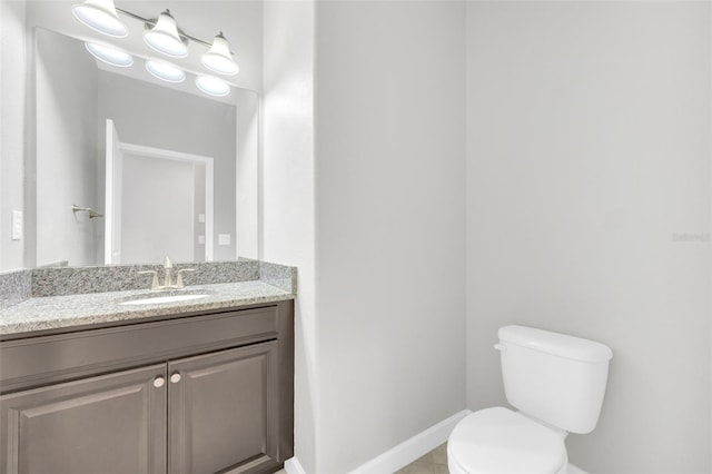 1028 Oliveto Verdi Ct, Brandon, FL 33511 - bathroom with toilet, vanity, baseboards, and tile patterned floors