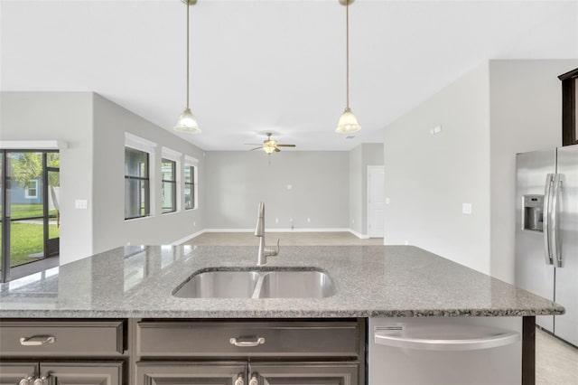1028 Oliveto Verdi Ct, Brandon, FL 33511 - kitchen with appliances with stainless steel finishes, a sink, a ceiling fan, open floor plan, and pendant lighting