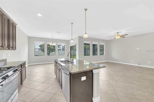 1028 Oliveto Verdi Ct, Brandon, FL 33511 - kitchen featuring a sink, appliances with stainless steel finishes, light tile patterned floors, a chandelier, and recessed lighting