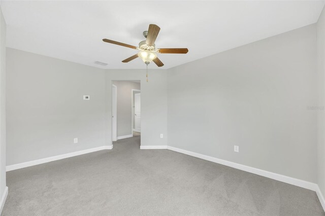 1028 Oliveto Verdi Ct, Brandon, FL 33511 - empty room featuring carpet floors, baseboards, and a ceiling fan