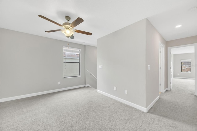 1028 Oliveto Verdi Ct, Brandon, FL 33511 - spare room with light carpet, baseboards, plenty of natural light, and a ceiling fan