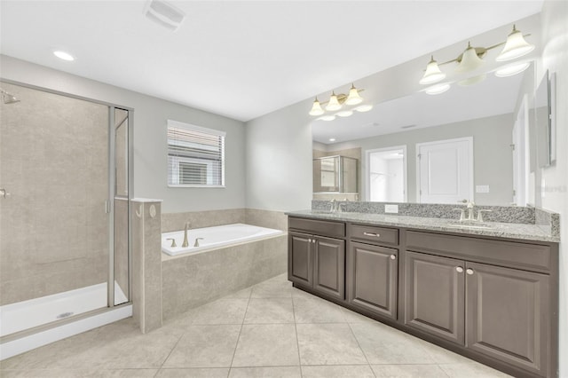 1028 Oliveto Verdi Ct, Brandon, FL 33511 - full bath featuring a shower stall, tile patterned flooring, a garden tub, and double vanity