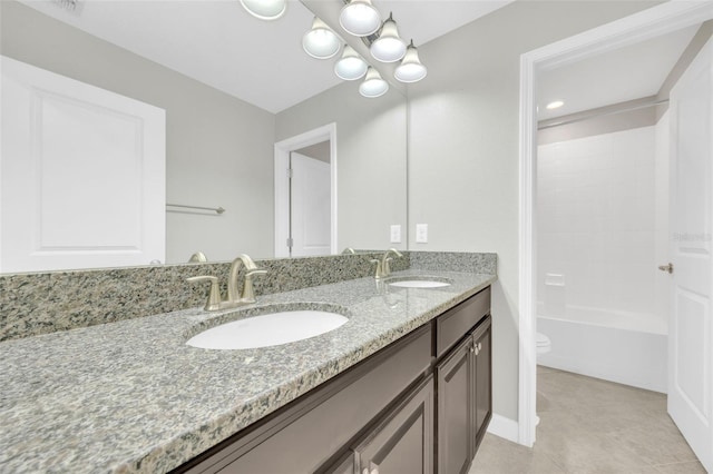 1028 Oliveto Verdi Ct, Brandon, FL 33511 - full bath featuring double vanity, toilet, tile patterned floors, and a chandelier