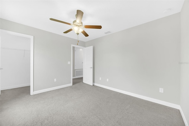 1028 Oliveto Verdi Ct, Brandon, FL 33511 - unfurnished bedroom featuring baseboards, carpet, and a ceiling fan