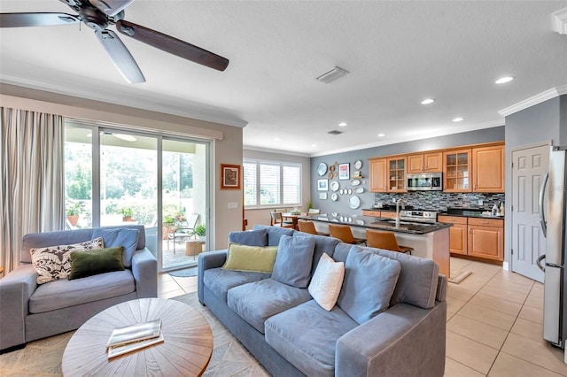 4717 Osprey Ridge Cir, Palm Harbor, FL 34684 - living area with crown molding, light tile patterned flooring, ceiling fan, and recessed lighting