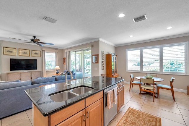 4717 Osprey Ridge Cir, Palm Harbor, FL 34684 - kitchen with stainless steel dishwasher, ornamental molding, a kitchen island with sink, open floor plan, and light tile patterned floors