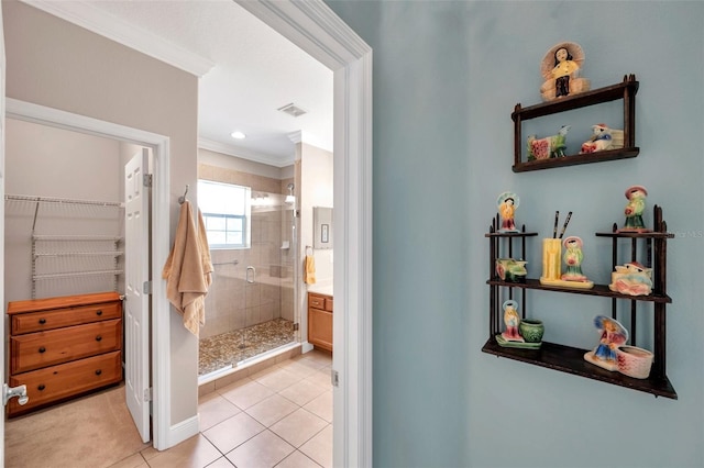 4717 Osprey Ridge Cir, Palm Harbor, FL 34684 - full bathroom featuring a stall shower, tile patterned floors, crown molding, a walk in closet, and vanity