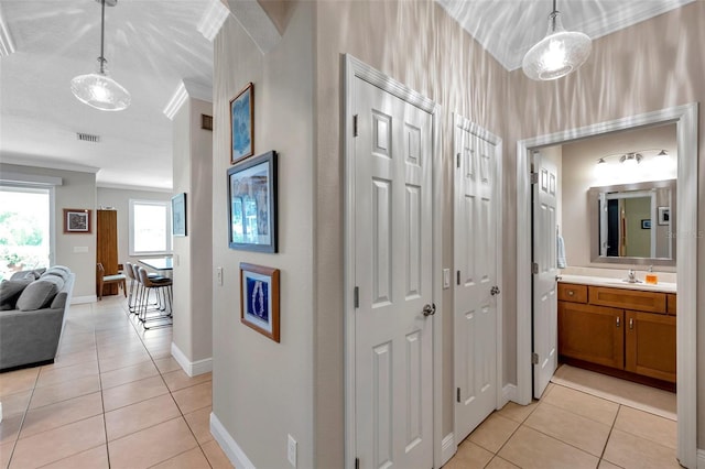 4717 Osprey Ridge Cir, Palm Harbor, FL 34684 - hall featuring light tile patterned flooring and ornamental molding