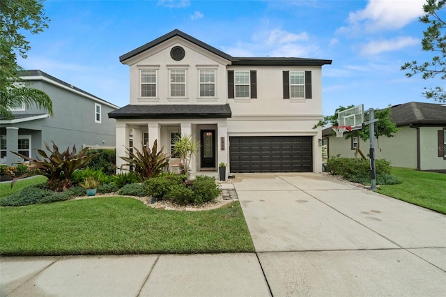 1844 Odiorne Point Ln, Wesley Chapel, FL 33543 - view of front facade featuring stucco siding, a garage, a front lawn, and driveway