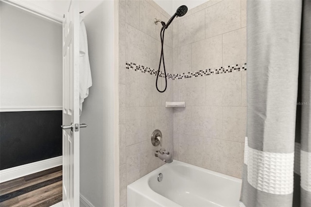 1844 Odiorne Point Ln, Wesley Chapel, FL 33543 - bathroom featuring wood finished floors, tub / shower combination, and baseboards