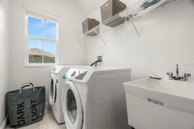 1844 Odiorne Point Ln, Wesley Chapel, FL 33543 - clothes washing area with separate washer and dryer, light tile patterned floors, and baseboards