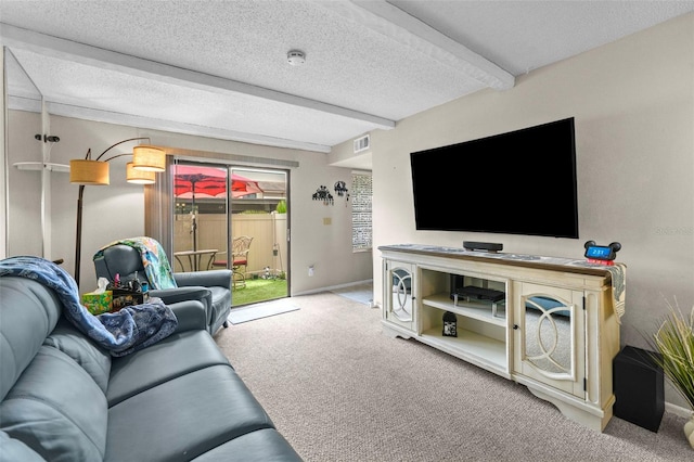 9209 Seminole Blvd Unit 156, Seminole, FL 33772 - living room featuring carpet floors, baseboards, a textured ceiling, and beam ceiling