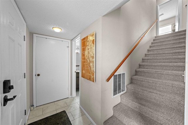 9209 Seminole Blvd Unit 156, Seminole, FL 33772 - entryway featuring a textured ceiling and stairs