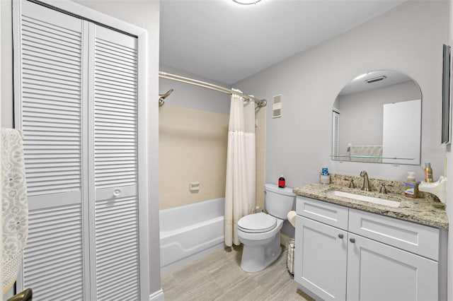 9209 Seminole Blvd Unit 156, Seminole, FL 33772 - bathroom featuring toilet, a closet, vanity, and shower / bath combination with curtain