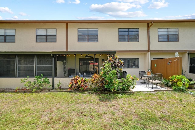 9209 Seminole Blvd Unit 156, Seminole, FL 33772 - back of house with a patio area, a yard, and stucco siding