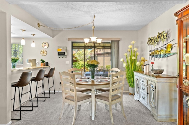 9209 Seminole Blvd Unit 156, Seminole, FL 33772 - dining room featuring light carpet, a chandelier, and a textured ceiling