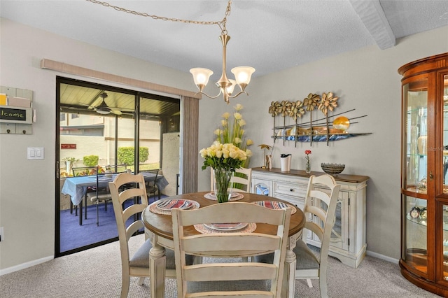 9209 Seminole Blvd Unit 156, Seminole, FL 33772 - dining room with carpet floors, a chandelier, and a textured ceiling