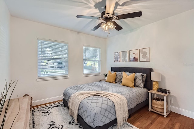 1145 53rd Ave N Unit 1, Saint Petersburg, FL 33703 - bedroom with baseboards, wood finished floors, and ceiling fan