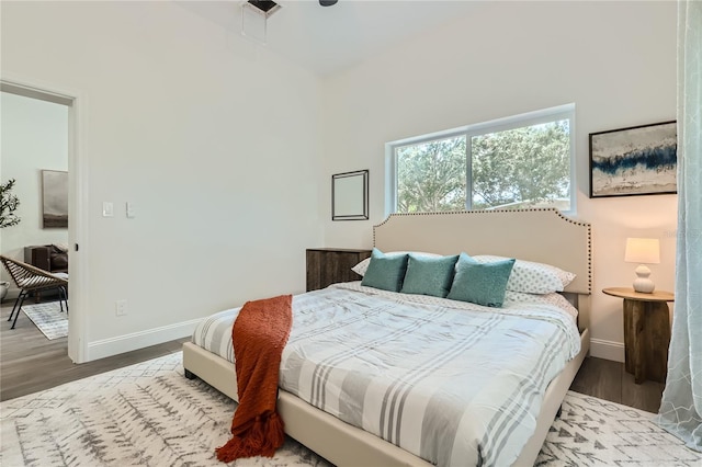 1145 53rd Ave N Unit 1, Saint Petersburg, FL 33703 - bedroom featuring wood finished floors, baseboards, and high vaulted ceiling