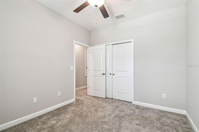 6745 Citrus Creek Ln, Tampa, FL 33625 - unfurnished bedroom featuring carpet flooring, baseboards, a closet, and a ceiling fan