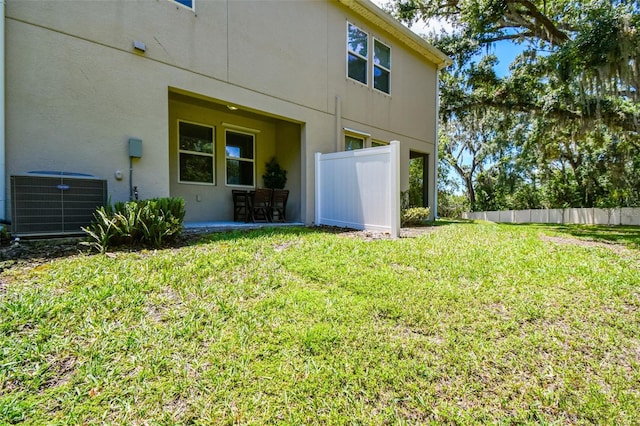 6745 Citrus Creek Ln, Tampa, FL 33625 - view of yard with central air condition unit and a patio area