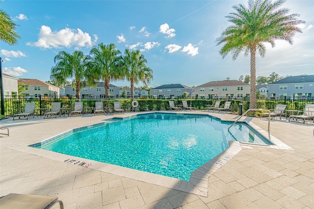 6745 Citrus Creek Ln, Tampa, FL 33625 - community pool featuring a residential view, a patio area, and fence
