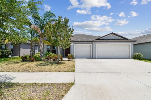 10822 Crushed Grape Dr, Riverview, FL 33578 - view of front facade featuring a garage, concrete driveway, stucco siding, and a front yard