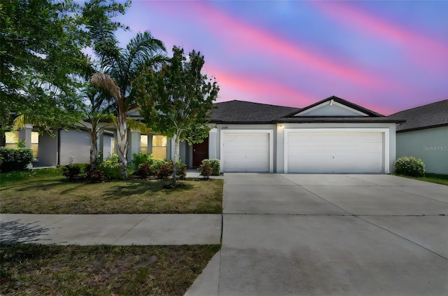 10822 Crushed Grape Dr, Riverview, FL 33578 - ranch-style house with a garage, concrete driveway, stucco siding, and a lawn