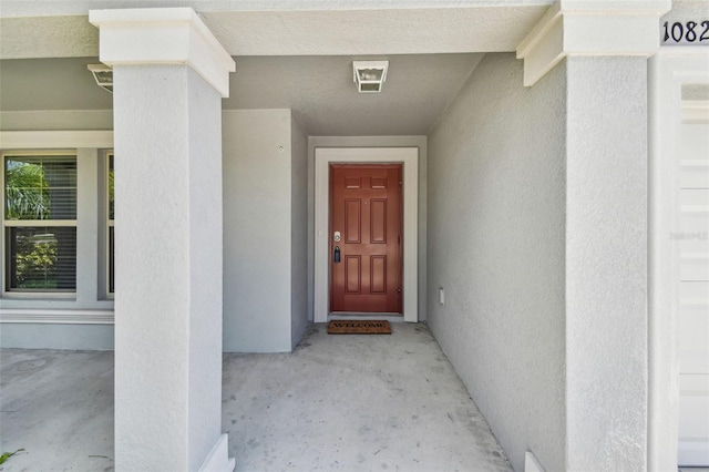 10822 Crushed Grape Dr, Riverview, FL 33578 - doorway to property featuring stucco siding