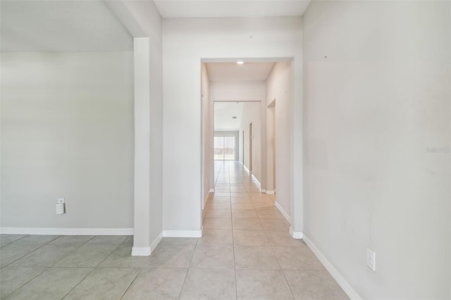 10822 Crushed Grape Dr, Riverview, FL 33578 - hallway with light tile patterned flooring and baseboards