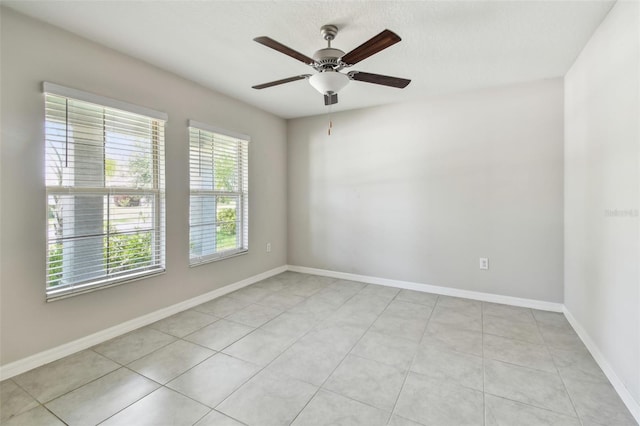 10822 Crushed Grape Dr, Riverview, FL 33578 - spare room with a ceiling fan, baseboards, and light tile patterned flooring
