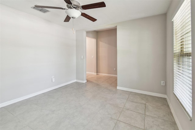 10822 Crushed Grape Dr, Riverview, FL 33578 - empty room with a ceiling fan, light tile patterned floors, and baseboards