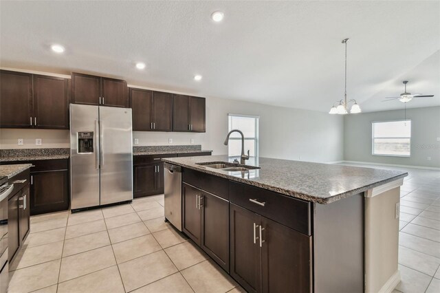 10822 Crushed Grape Dr, Riverview, FL 33578 - kitchen featuring stainless steel appliances, a sink, healthy amount of natural light, light tile patterned floors, and recessed lighting