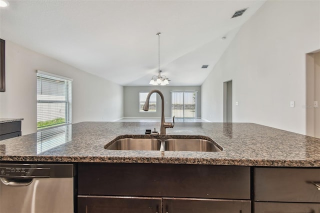 10822 Crushed Grape Dr, Riverview, FL 33578 - kitchen with a sink, stainless steel dishwasher, dark brown cabinets, dark stone counters, and lofted ceiling