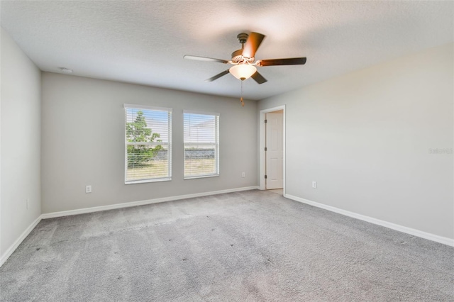 10822 Crushed Grape Dr, Riverview, FL 33578 - spare room featuring ceiling fan, carpet floors, baseboards, and a textured ceiling