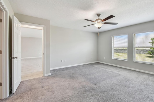 10822 Crushed Grape Dr, Riverview, FL 33578 - carpeted spare room featuring ceiling fan, a textured ceiling, and baseboards