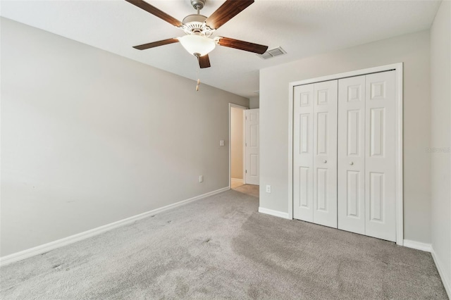 10822 Crushed Grape Dr, Riverview, FL 33578 - unfurnished bedroom featuring carpet floors, baseboards, a closet, and a ceiling fan
