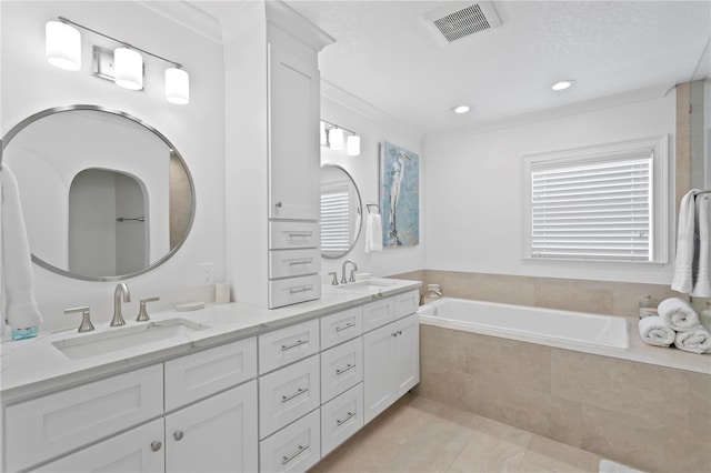 7060 S Shore Dr S, South Pasadena, FL 33707 - full bathroom featuring double vanity, a bath, tile patterned floors, ornamental molding, and recessed lighting