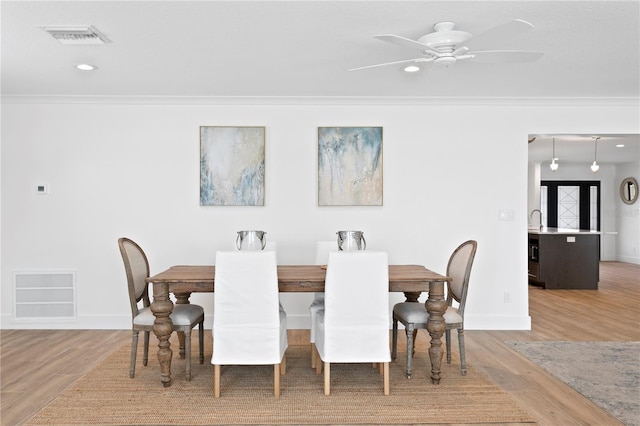 7060 S Shore Dr S, South Pasadena, FL 33707 - dining room featuring wood finished floors, recessed lighting, baseboards, a ceiling fan, and crown molding