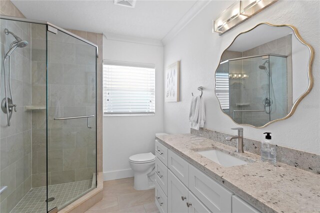 7060 S Shore Dr S, South Pasadena, FL 33707 - full bathroom featuring vanity, a stall shower, toilet, crown molding, and tile patterned floors