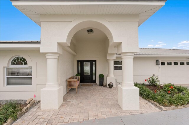 7060 S Shore Dr S, South Pasadena, FL 33707 - entrance to property featuring stucco siding and a garage