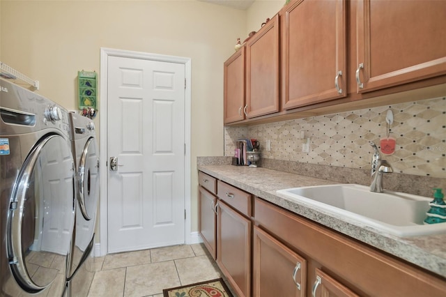 1116 Hillandale Reserve Dr, Tampa, FL 33613 - laundry area featuring independent washer and dryer, cabinet space, and light tile patterned floors